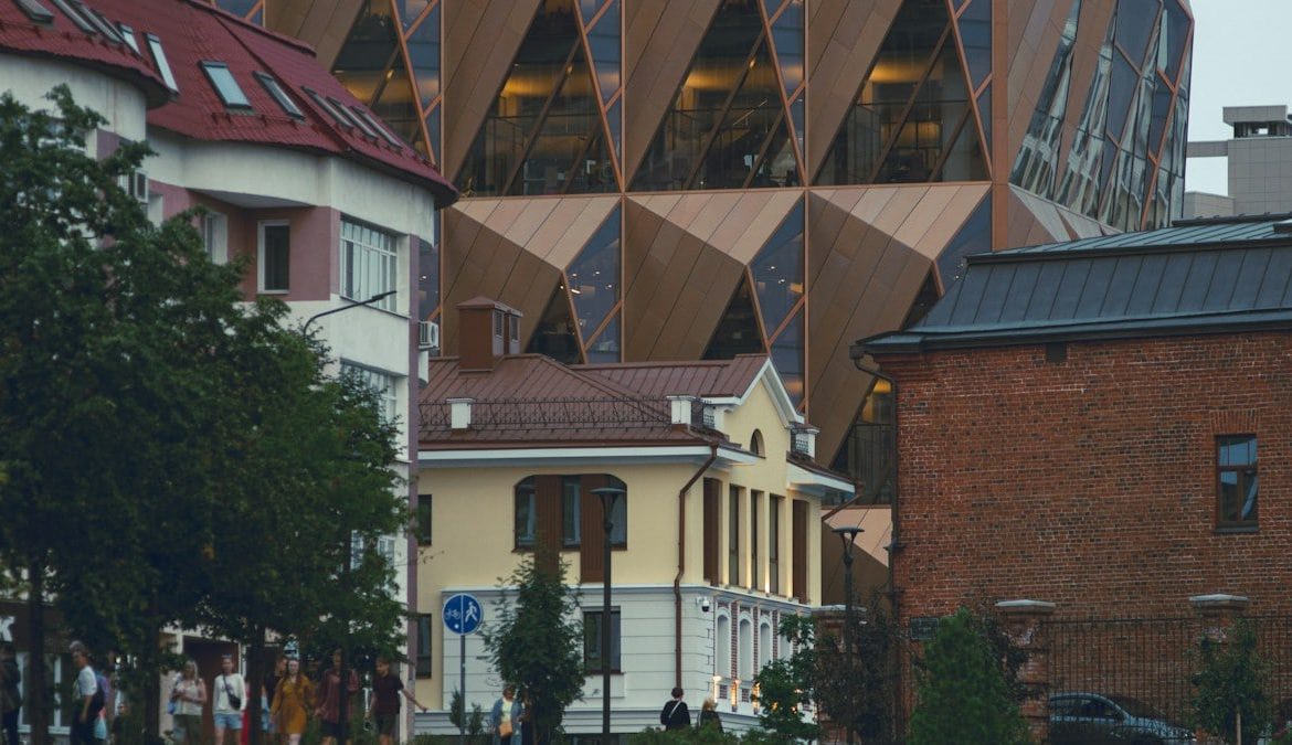 a group of people walking outside of a building